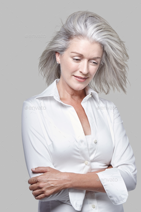 Portrait, attractive vivacious mature Caucasian woman with silver hair ...