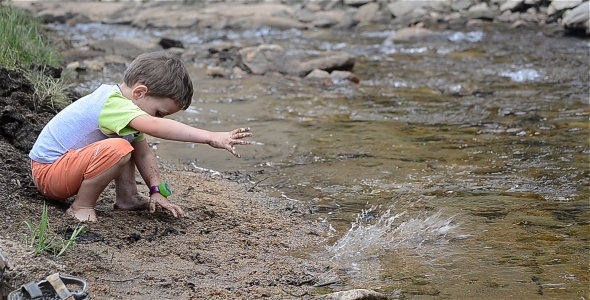 Child Playing By The River 1