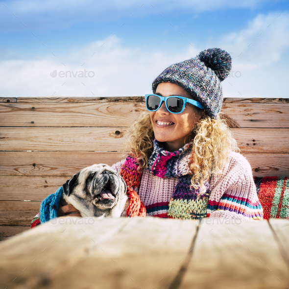 Winter cold season and friendship concept with cheerful and beautiful woman portrait