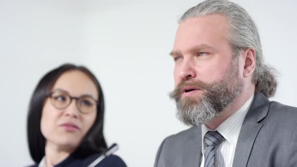 Male Bearded Speaker at News Conference Meeting alt