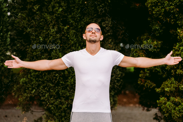 Download Placeit Man Wearing White T Shirt Mockup Outdoors Stock Photo By Avanti Photo