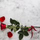 Red roses on grey stone background. - PhotoDune Item for Sale