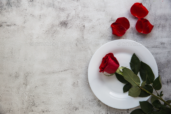 Festive table setting with red roses for valentines day. - Stock Photo - Images