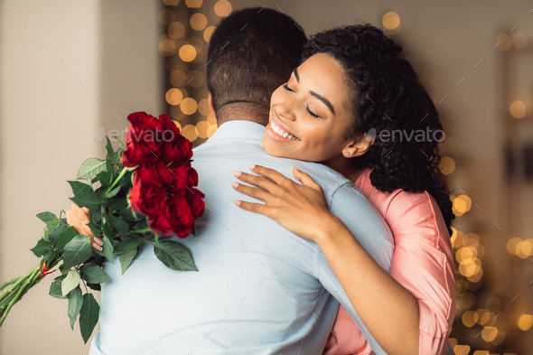 Vibrant Passionate African American Man and Woman with Roses