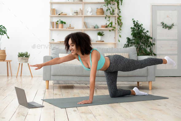 Online workout in free time at home alone in morning Stock Photo by  Prostock-studio