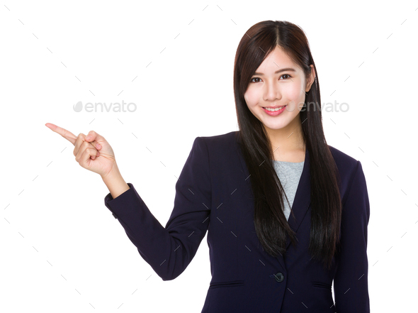 Young businesswoman with finger point upwards