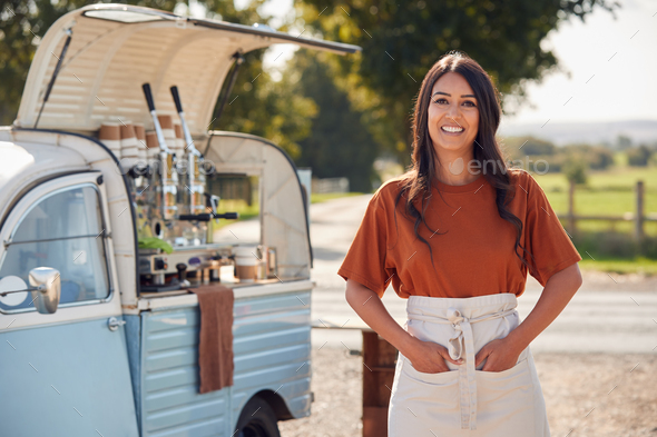 Portrait Of Woman Running Independent Mobile Coffee Shop Standing Outdoors Next To Van