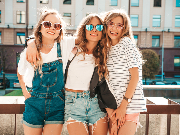 Portrait of three young beautiful women posing outdoors Stock Photo by ...
