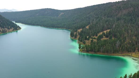 Flying high over Cliff Lake in Montana viewing the aqua colors in the water alt