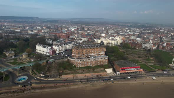 Aerial view of the famous Grade 2 listed Grand Hotel. Along with that a large bridge is seen and man alt