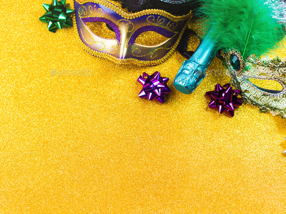 Carnival mardi gras party masks on gold background Stock Photo by tenkende