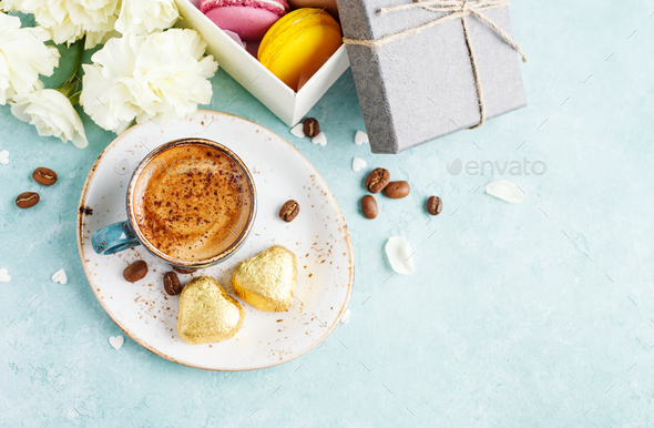 Cup of coffee with foam and chocolate candies - Stock Photo - Images