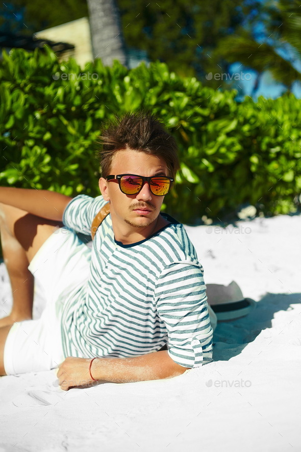 Portrait of an attractive young man on a tropical beach stock photo  (184999) - YouWorkForThem