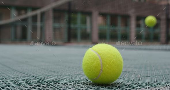 Tennis ball on a tennis court - Stock Photo - Images