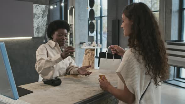 Woman Purchasing Jewelry alt