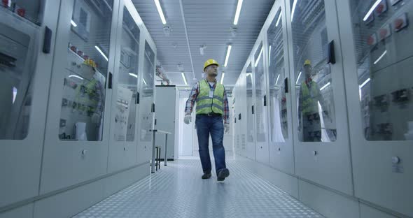 Electrical Worker Walking Down the Hall alt