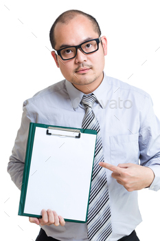 Businessman show clipboard with finger