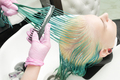 Hairdresser Holding Wet Hair in Hand and Brushes Long Green Hair While Washing Head in Shower - PhotoDune Item for Sale