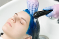 Hairdresser Washes Client&#39;s Head with Sapphire Hair Color After Hair Coloring Process - PhotoDune Item for Sale