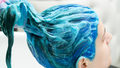 Hairdresser Holds Long Blue Hair in Hand While Washing Hair After Process Dyeing Hair in Blue Color - PhotoDune Item for Sale