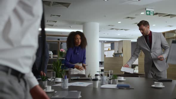 Multiracial Office Team Discuss Corporate Data on Business Conference Meeting alt