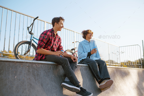 Bmx bikers leisures in skatepark after training