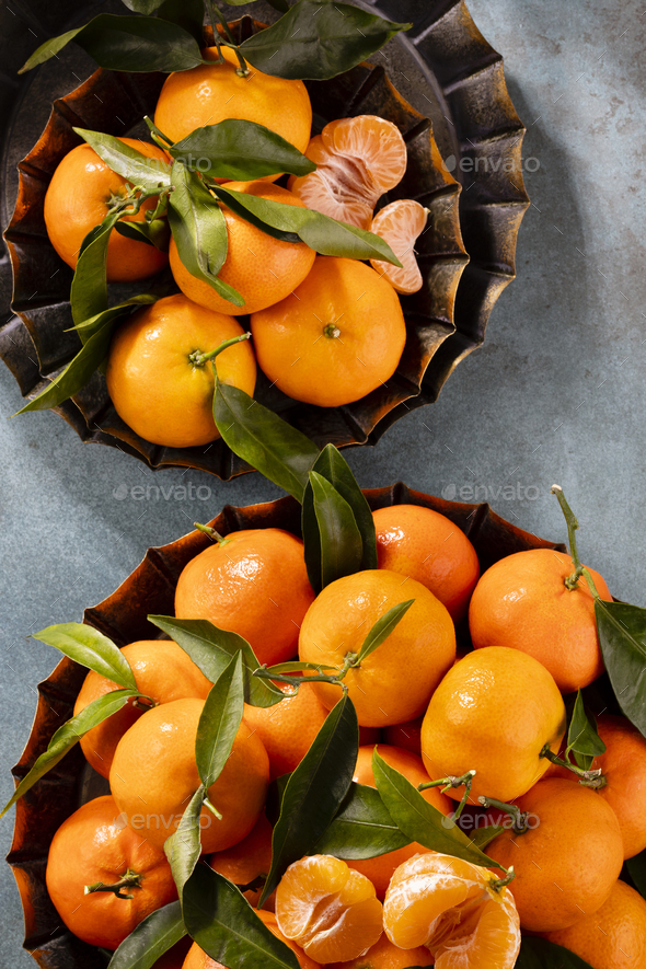 Fresh mandarin oranges fruit or tangerines with leaves in wooden box, top  view Stock Photo by GitaKulinica