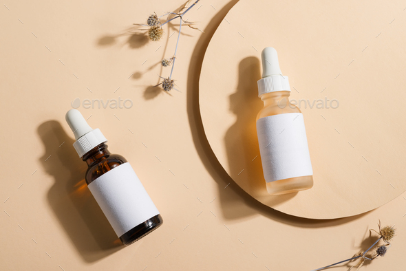 Download Mockup Cosmetic Bottles With A Dropper On A Beige Background With Bright Sunlight Stock Photo By Lyulkamazur