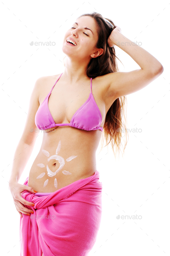Woman with sun cream on her stomach - Stock Photo - Images