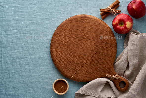 Food background mockup for cakes with spices, fruits and round wooden cutting board