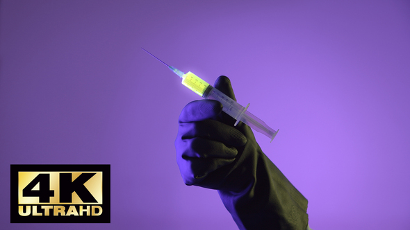 Syringe With A Glowing Liquid