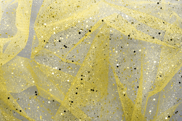 Yellow glitter pattern on a gray background