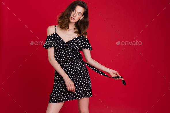 stylish woman in summer fashion trend dress on red background Stock ...