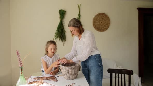 Woman with Daughter and Mother Working with Baskets
