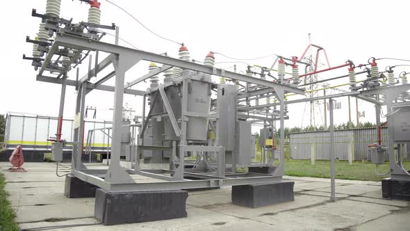 Air High-voltage Switches. Electrical Poles with Wires and Insulators at the Electrical Substation alt