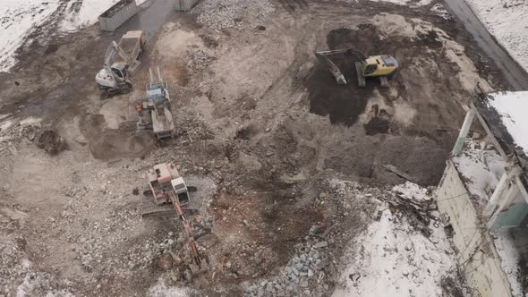 Aerial View Excavators Are Working On The Dismantling Of The Plant alt
