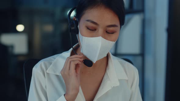 Asia young call center team or customer support service executive wearing face mask prevent .