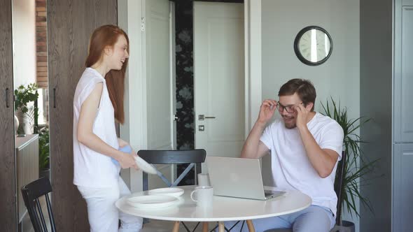 Handsome Guy Work From Home, Smiling Woman Always Near Him alt