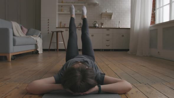 Young Woman Doing Core Workout
