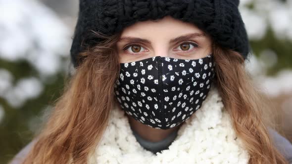 Portrait of a Young Tourist Woman Wearing Protective Face Mask on Street Crowd People