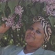 Portrait of African American Woman with Lilac Bush