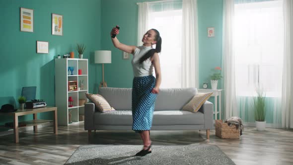 Young Woman Dancer Has Fun at Home