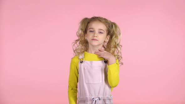 Female Kid with Blond Hair Is Feeling Sick. Slow Motion alt