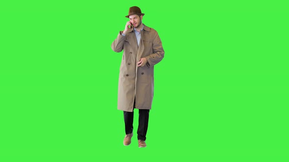 Vintage Detective Agent Wearing Beige Coat Work Undercover Making Phone Call on Mobile Smartphone on