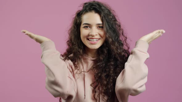Slow Motion Portrait of Playful Woman Hiding Face with Hands Then Looking at Camera Smiling Enjoying alt