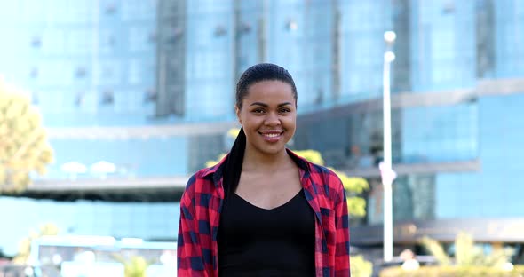 Come to me, I want to embrace you. Stylish black woman spread hands. alt