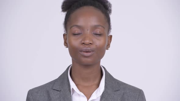Face of Young Happy African Businesswoman Relaxing with Eyes Closed alt