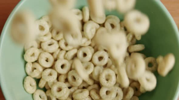 Slow Motion Close Up Breakfast Cereal Falling into Bowl 120fps Dolly Zoom In