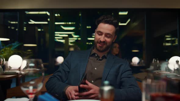 Man Nfc Paying Dinner in Fancy Restaurant alt