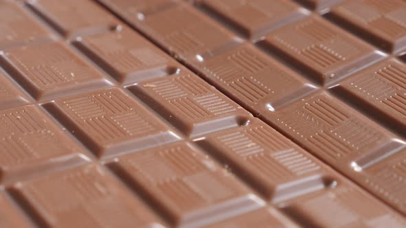 Shiny chocolate bar surface  tasty confection shallow DOF tilting 4K 2160p UltraHD footage - Slow ti alt